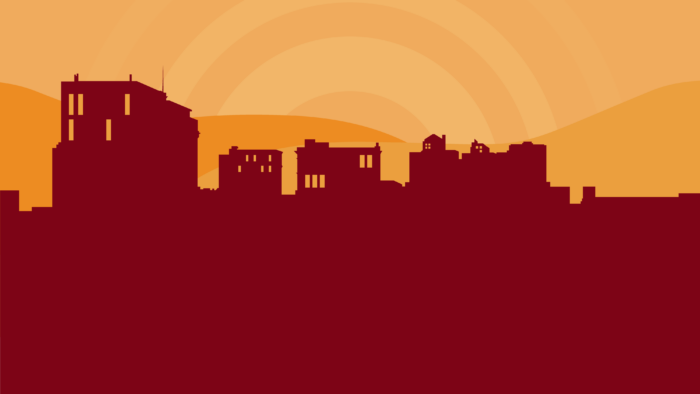 An illustrated graphic of city skyline in front of a mountain backdrop.